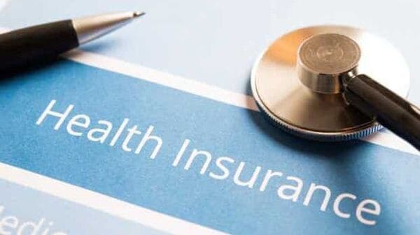 A doctor reviewing health insurance plans with a patient.