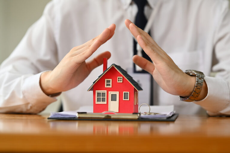 A family reviewing their homeowners insurance policy together in their living room.